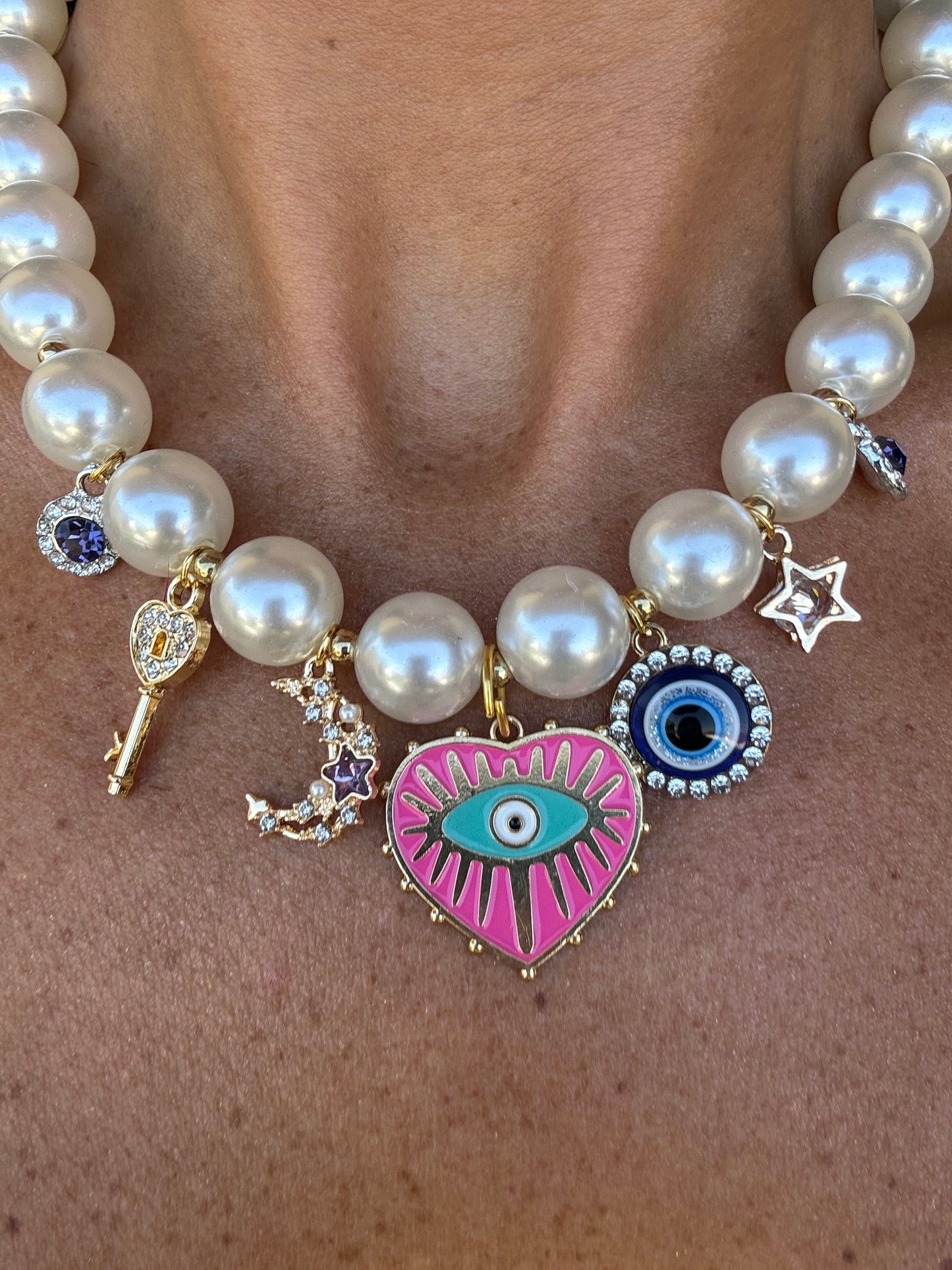 Collana perle e charm occhio greco