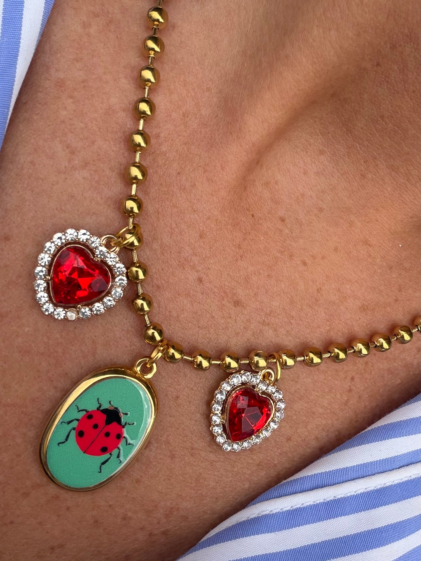Collana 3 charm Coccinella ๐